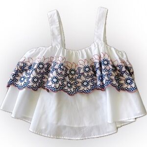 White top with blue and pink floral detail